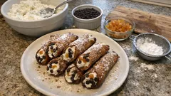 Cannoli siciliani fatti in casa: cialde croccanti e ricotta profumata all’arancia