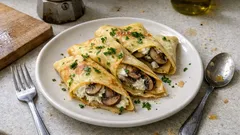 Crespelle ai funghi con ricotta e Parmigiano: cremose e semplici, perfette per cena