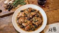 Coniglio alla ligure in tegame: olive taggiasche e pinoli per un sughetto intenso